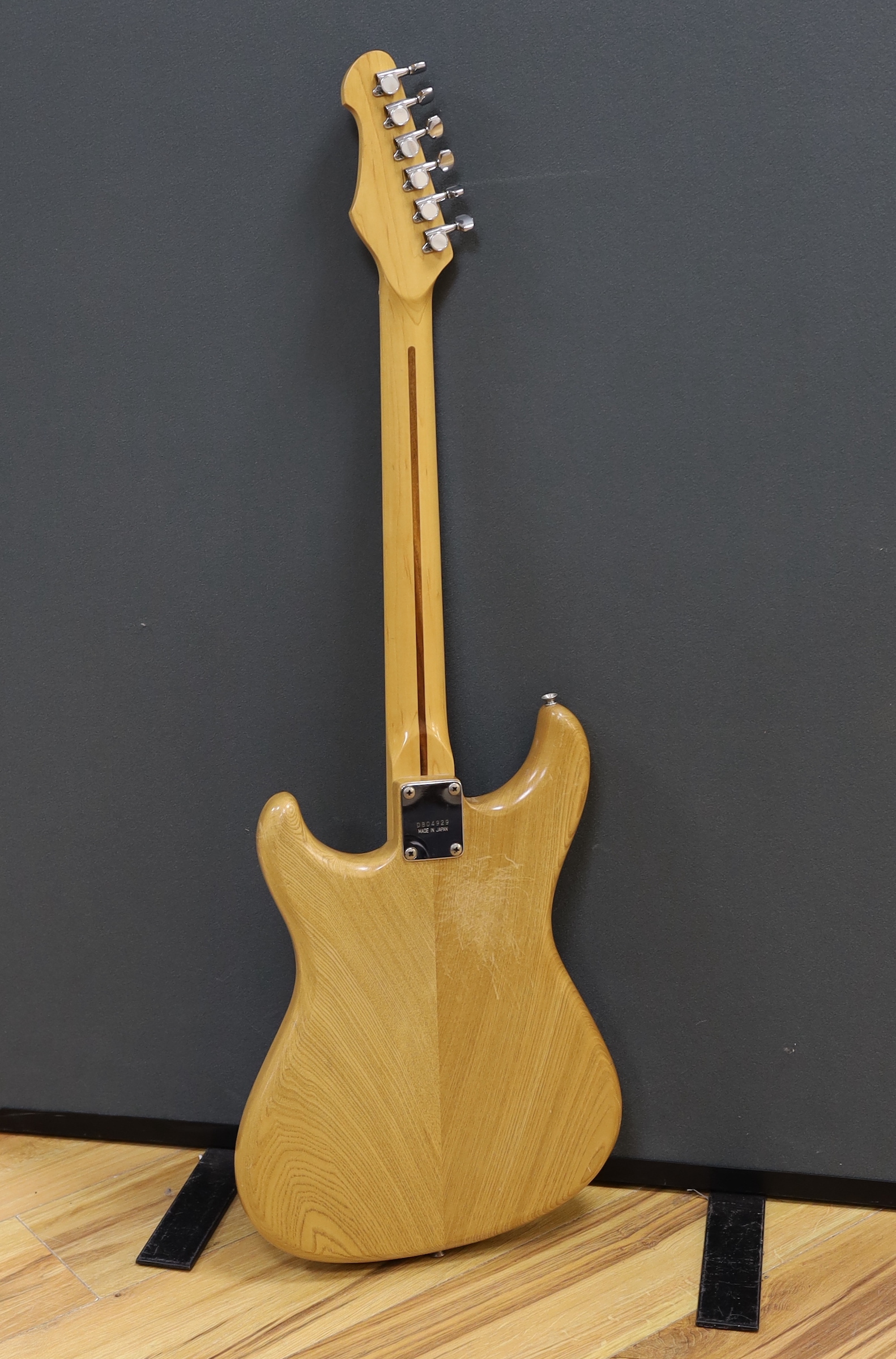 A 1980 Electric guitar by Ibanez, Japan, Blazer Series in natural finish with flight case and a small Fender Frontman 15G amp